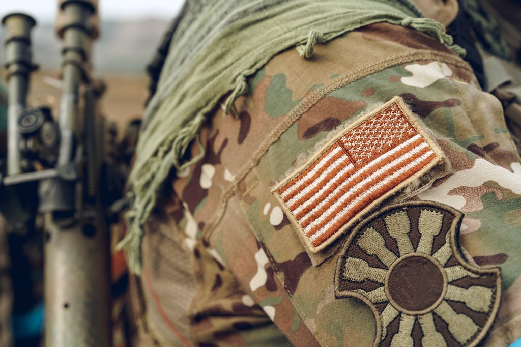 USA flag patch on military uniform of american soldier
